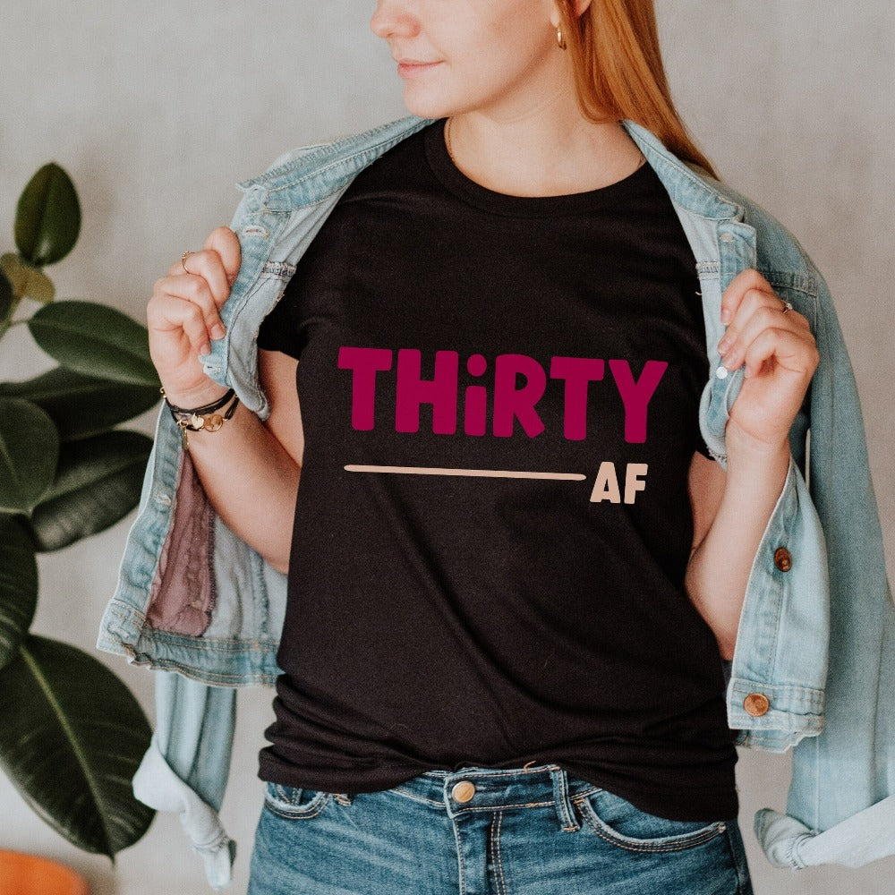 "Hello Thirty". Planning of a birthday celebration? Let's get this sassy thirty t-shirt as a female matching outfit on 30th birthday for yourself, mom, sister, daughter and bestfriend on any birthday celebration ideas like a party or road trip.  
