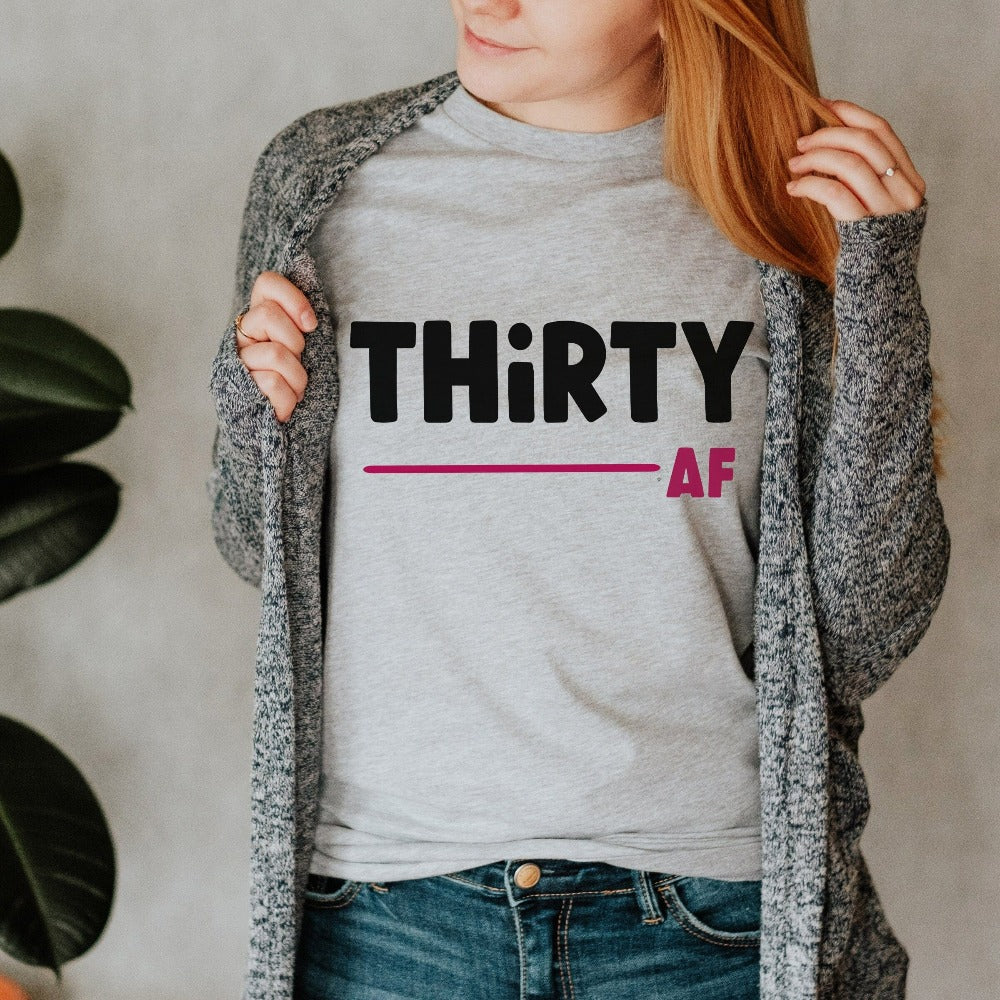 "Hello Thirty". Planning of a birthday celebration? Let's get this sassy thirty t-shirt as a female matching outfit on 30th birthday for yourself, mom, sister, daughter and bestfriend on any birthday celebration ideas like a party or road trip.   