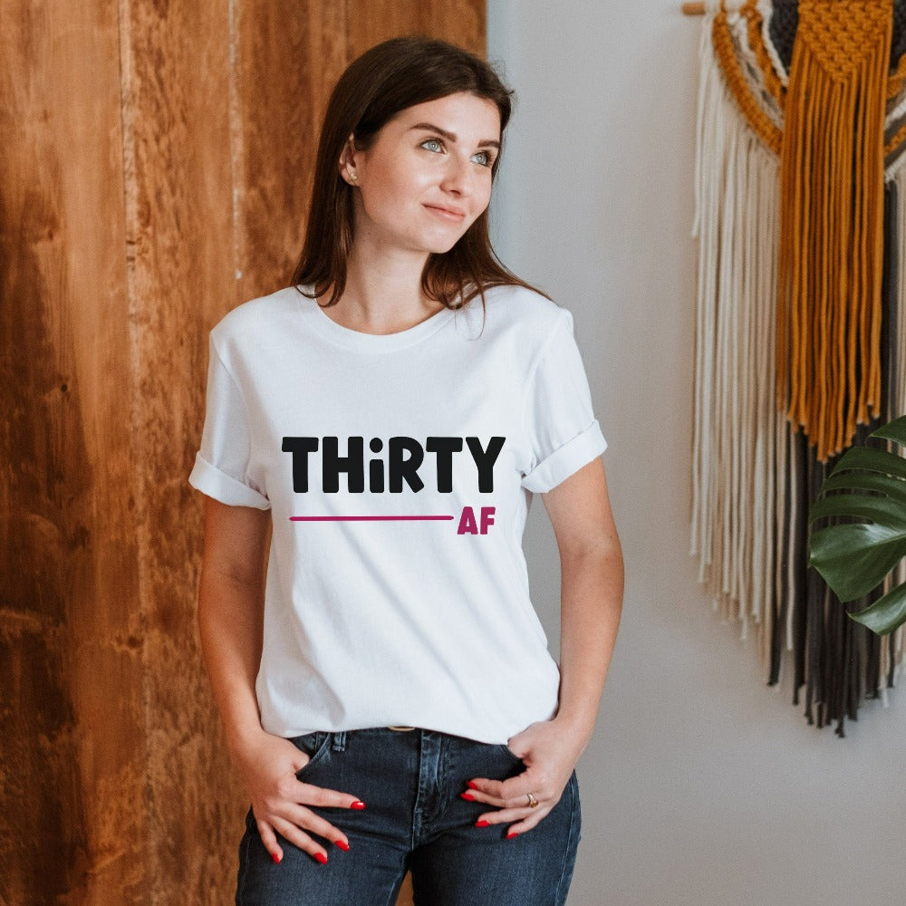 "Hello Thirty". Planning of a birthday celebration? Let's get this sassy thirty t-shirt as a female matching outfit on 30th birthday for yourself, mom, sister, daughter and bestfriend on any birthday celebration ideas like a party or road trip.  