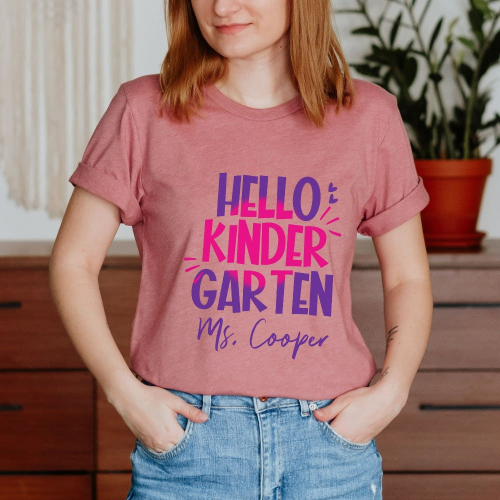 Hello Kindergarten! Customize this retro vibrant new grade shirt as a thank you gift idea for teacher, trainer, instructor and homeschool mama. Create a custom look and show appreciation to your favorite grade teacher with this unique shirt. Perfect for elementary team spirit, back to school, last day of school, summer or spring break. Great outfit for everyday use both in and out of the classroom.