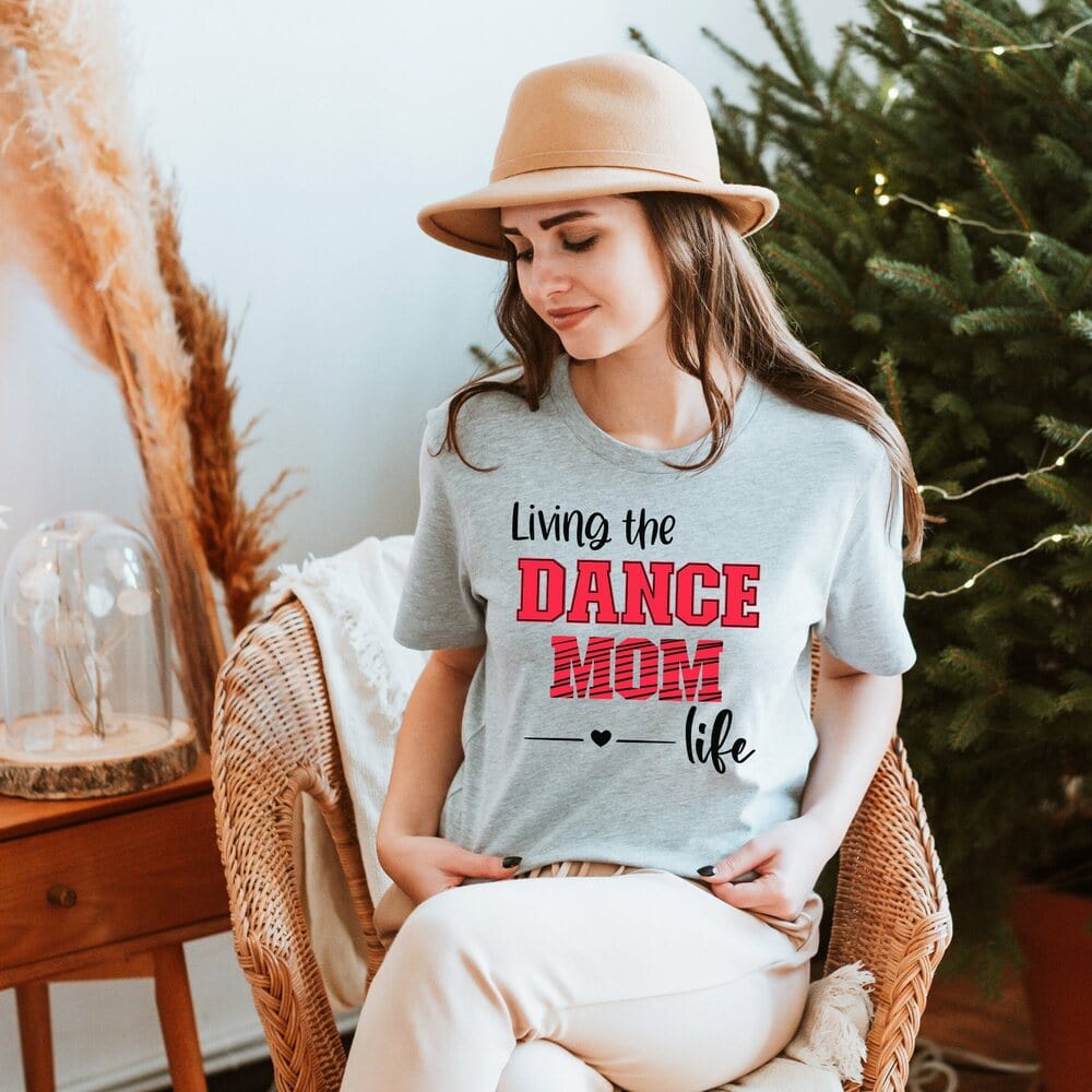 The style of our dance recital mom outfit has striking print colors and is perfectly combined to give it a more girlish, modish, chic look. Every dance mama will love wearing it all day long because of its pleasant, warm, and cozy fabric. Favorite Mom Tee