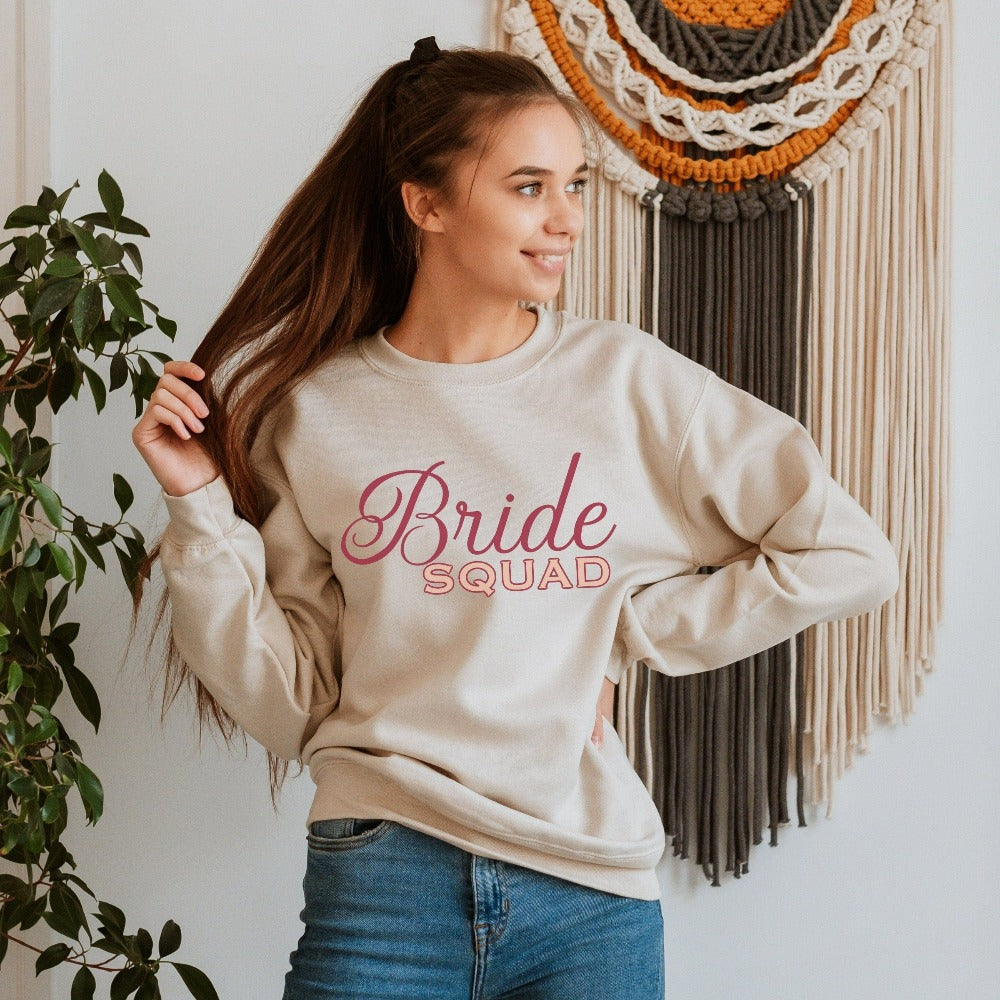 This matching bride squad sweatshirt is a perfect bridesmaid invitation or proposal box gift idea. Perfect as an engagement announcement surprise shirt, bachelorette party outfit, gift for bridesmaid or maid of honor, rehearsal night dinner outfit for mother of the bride, mother of the groom and any other crew member involved in your wedding planning activities.