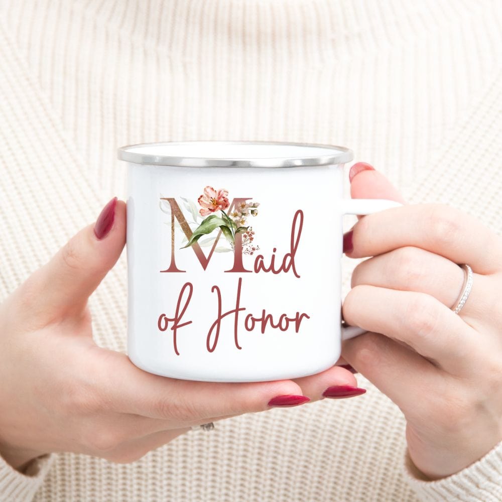 Floral maid of honor wedding party coffee mug souvenir for matron of honor. Great idea for engagement announcement, bachelorette party, bridesmaid proposal box gift idea, rehearsal dinner, and after wedding parties. This cute getting ready present is a perfect addition for the bride's crew, team or squad.