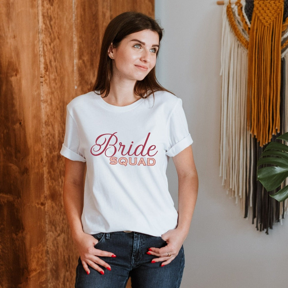 This matching bride squad shirt is a perfect bridesmaid invitation or proposal box gift idea. Perfect as an engagement announcement surprise shirt, bachelorette party casual tee, gift for bridesmaid or maid of honor, rehearsal night dinner outfit for mother of the bride, mother of the groom and any other crew member involved in your wedding planning activities.