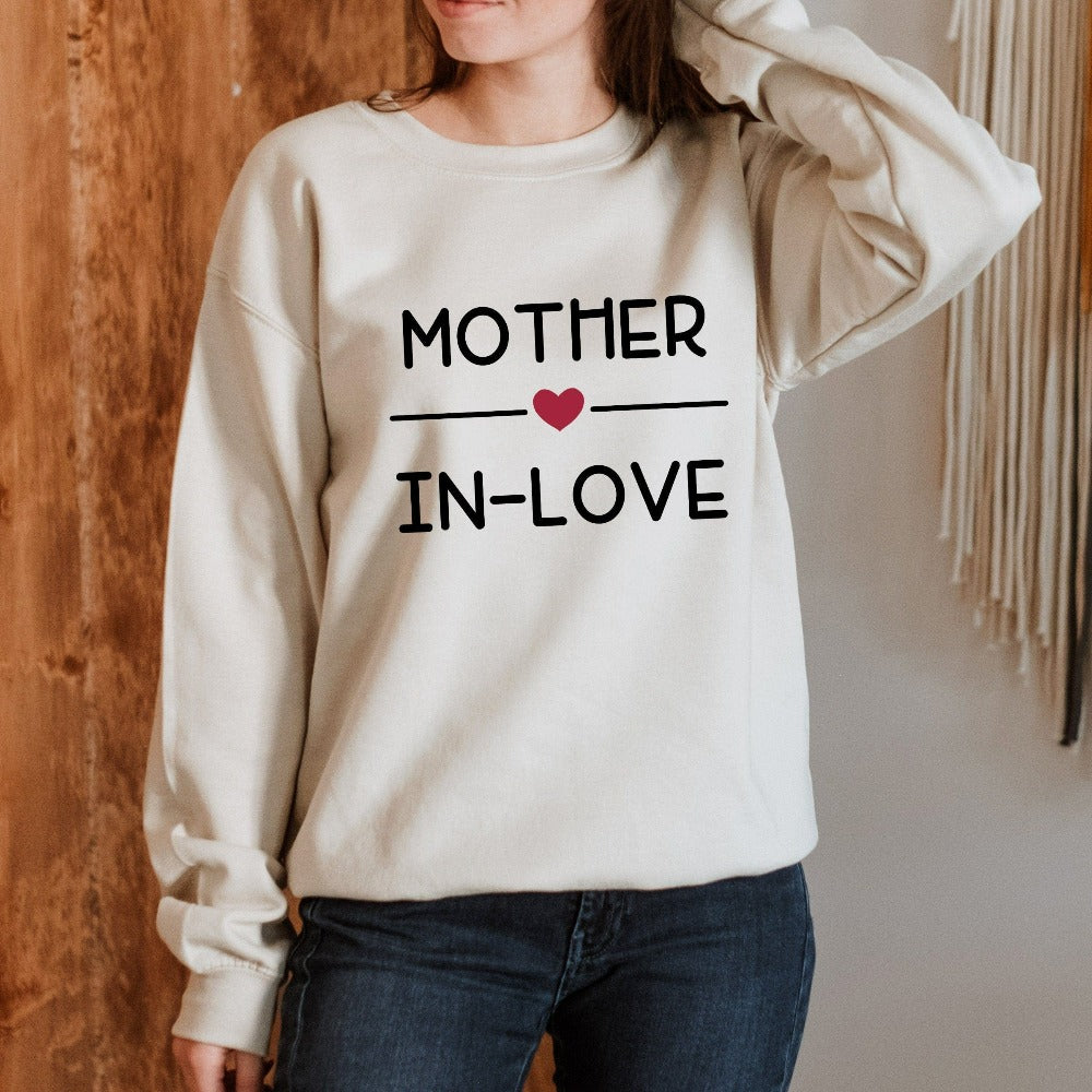 This trendy mother-in-law sweatshirt is a perfect gift idea to in-law from the future daughter-in-law or son-in-law. A trendy outfit on the day of the future bride and groom surprise wedding announcement or engagement party. 