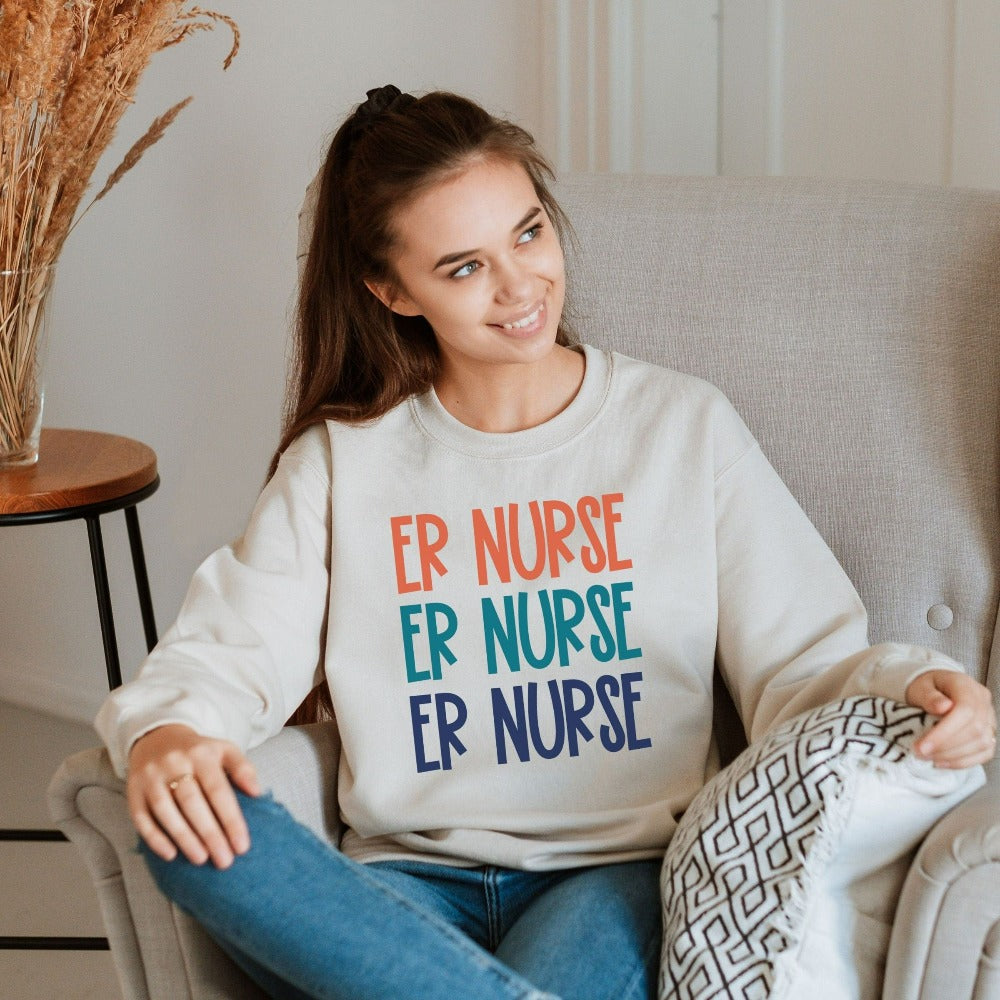 Emergency Nurse sweatshirt. This cute retro gift idea works for Nursing Graduate, New Nurse, Emergency Department Unit, ER Crew. Perfect appreciation thank you gift for hospital ward favorite nurse team and co-workers. Great staff work shirt for both night and day shifts.