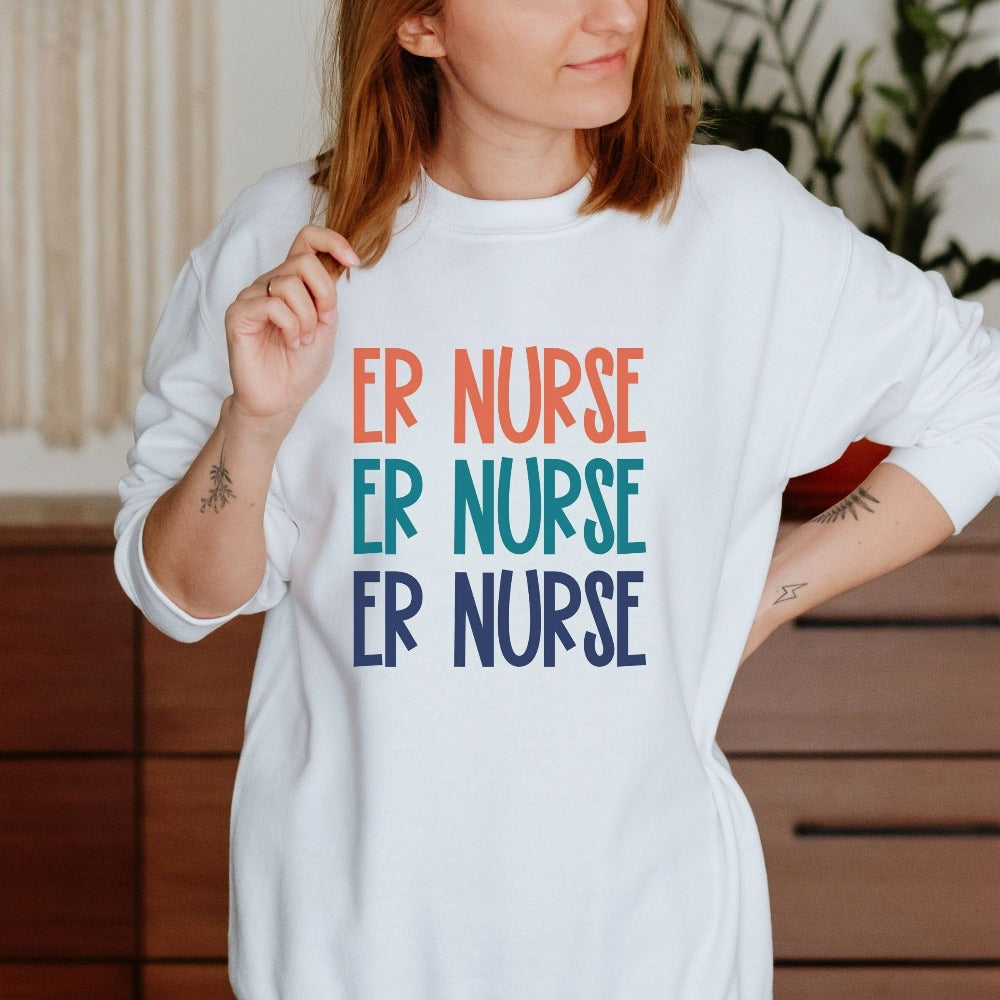 Emergency Nurse sweatshirt. This cute retro gift idea works for Nursing Graduate, New Nurse, Emergency Department Unit, ER Crew. Perfect appreciation thank you gift for hospital ward favorite nurse team and co-workers. Great staff work shirt for both night and day shifts.