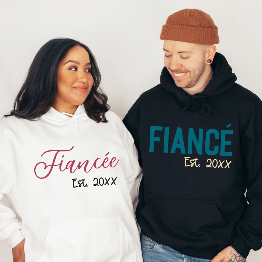 Fiancé and fiancée matching couples sweatshirt. Getting ready for a honeymoon vacation, family reunion cruise to celebrate your engagement? This his and hers matching outfit is always a hit. Customized with date, it is a perfect bridal party wedding gift sweatshirt for bride and groom. Also great as a welcome gift for future soon-to-be daughter-in-law or son-in-law and new Mr. and Mrs.