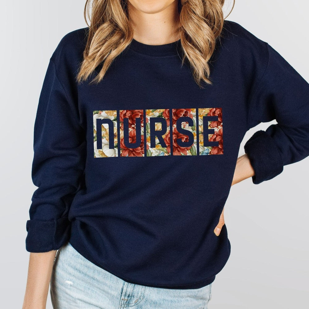 Floral Nurse sweatshirt. This adorable gift idea works for Nursing Graduate, New Nurse, Emergency Department, Operating Theatre, Neonatal NICU, ICU, RN and more. Perfect appreciation thank you gift for hospital ward favorite nurse team, surgical unit crew and co-workers. Great staff shirt for both night and day shifts.