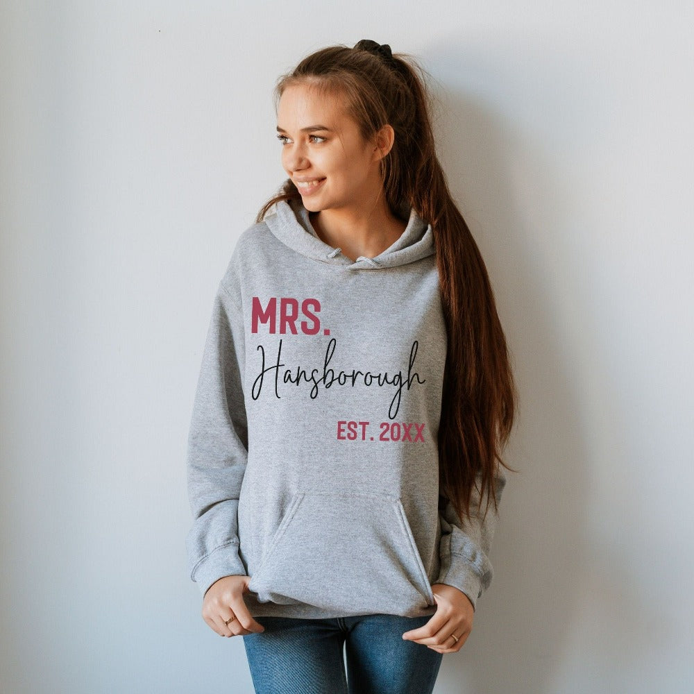 Grab this adorable wedding sweatshirt for the newest bride to be. Customized with name and date, this cute gift idea is perfect for a bridal shower present for the soon to be Mrs. or engagement anniversary gift for wife/spouse. Custom personalized bachelorette shirt outfit.