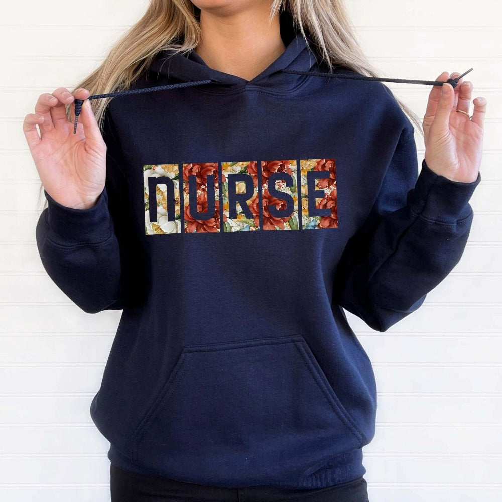 Floral Nurse sweatshirt. This adorable gift idea works for Nursing Graduate, New Nurse, Emergency Department, Operating Theatre, Neonatal NICU, ICU, RN and more. Perfect appreciation thank you gift for hospital ward favorite nurse team, surgical unit crew and co-workers. Great staff shirt for both night and day shifts.