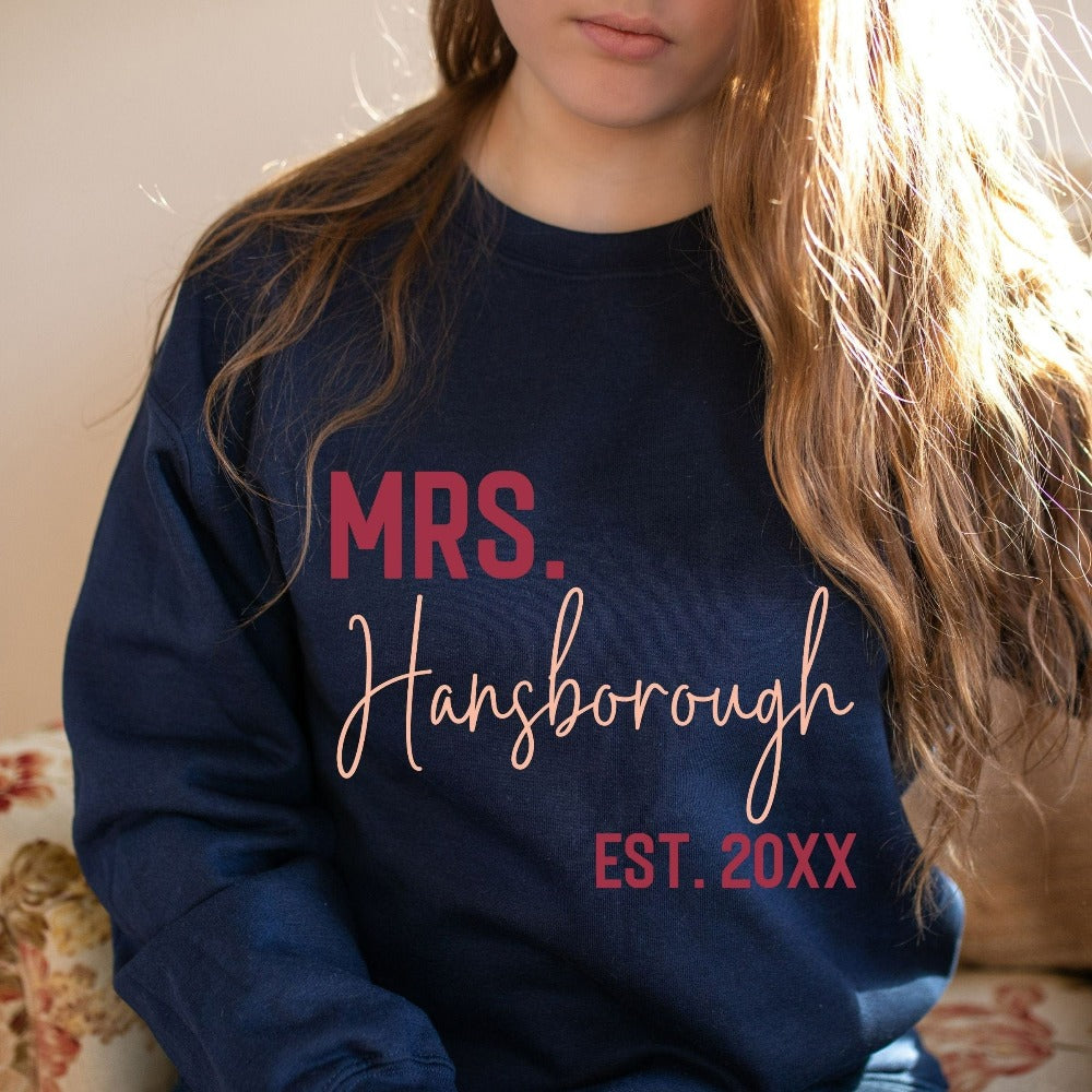 Grab this adorable wedding sweatshirt for the newest bride to be. Customized with name and date, this cute gift idea is perfect for a bridal shower present for the soon to be Mrs or engagement anniversary gift for wife/spouse. Custom personalized bachelorette shirt outfit.
