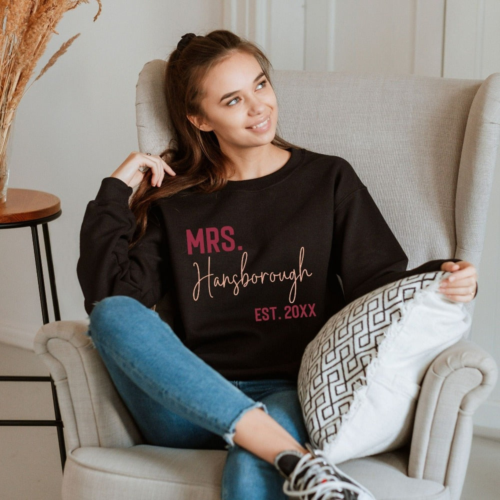 Grab this adorable wedding sweatshirt for the newest bride to be. Customized with name and date, this cute gift idea is perfect for a bridal shower present for the soon to be Mrs or engagement anniversary gift for wife/spouse. Custom personalized bachelorette shirt outfit.
