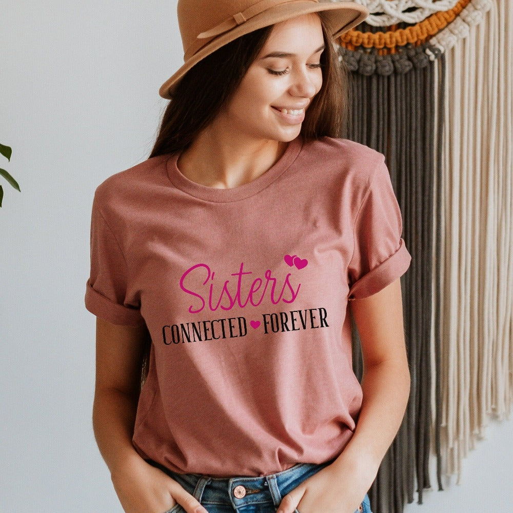 Adorable connected sisters' matching shirt gift idea. Whether she is a long distance away or close by, celebrate your sister by birth, sorority, chance or circumstance with this lovely matching outfit for your loved one or twin. Cute casual tee for cruise vacations, family camping reunion, birthdays, Christmas holiday, Thanksgiving visit, girls road trip or airport travel. 