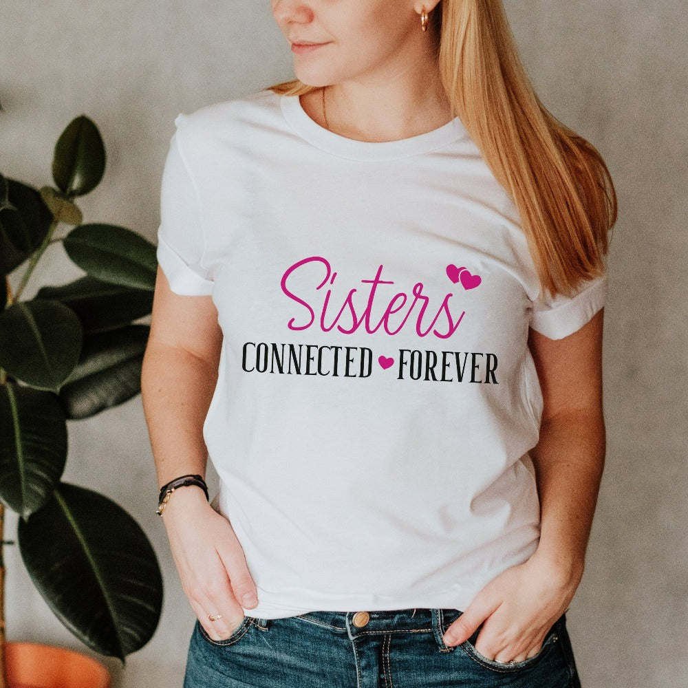 Adorable connected sisters' matching shirt gift idea. Whether she is a long distance away or close by, celebrate your sister by birth, sorority, chance or circumstance with this lovely matching outfit for your loved one or twin. Cute casual tee for cruise vacations, family camping reunion, birthdays, Christmas holiday, Thanksgiving visit, girls road trip or airport travel. 