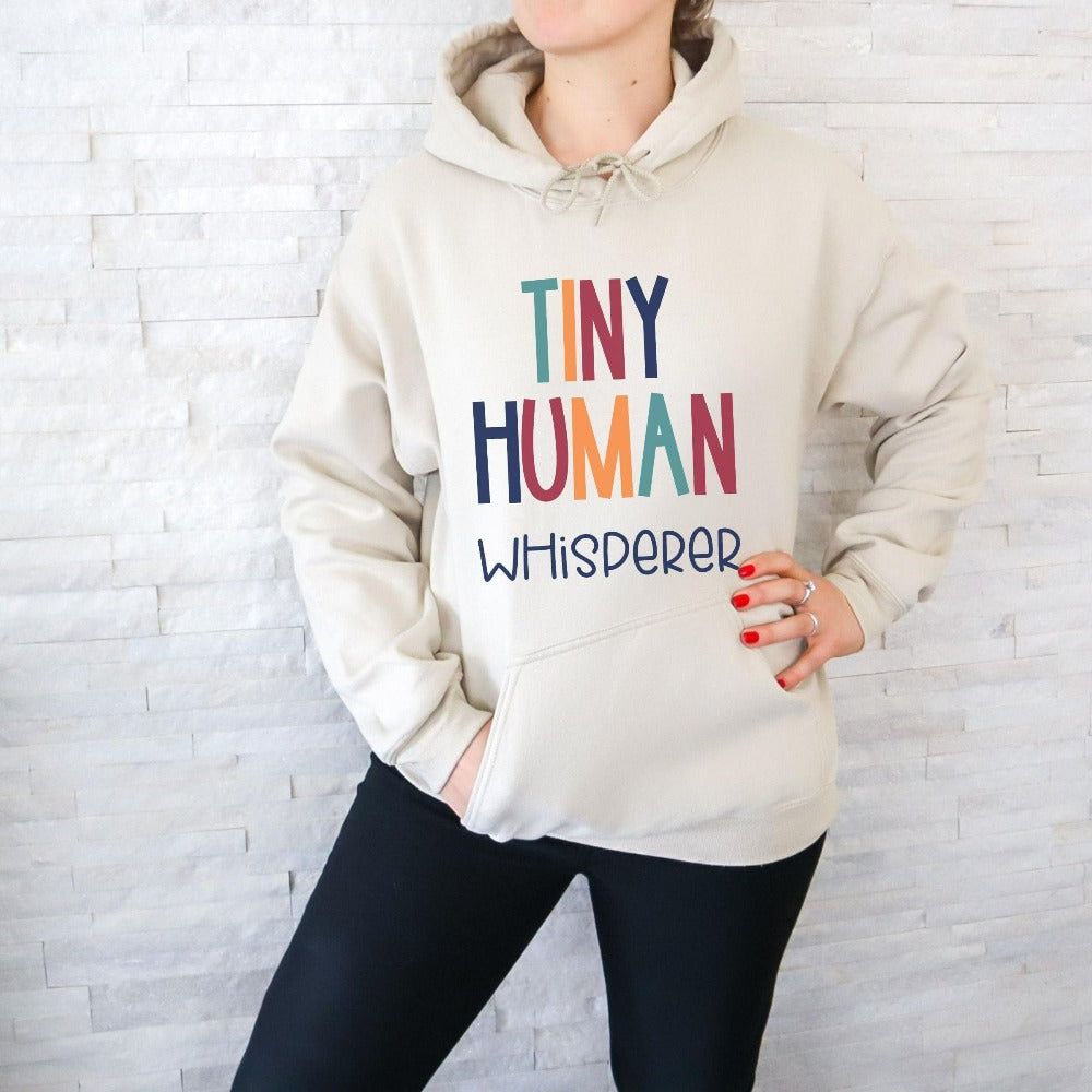 Tiny Humans Whisperer funny sweatshirt gift idea for teacher, trainer, instructor and homeschool mama. Show appreciation to your favorite grade teacher with this retro bold and colorful humorous shirt. Perfect for elementary, middle or high school, back to school, last day of school, summer or spiring break. Great for everyday use both in and out of the classroom.