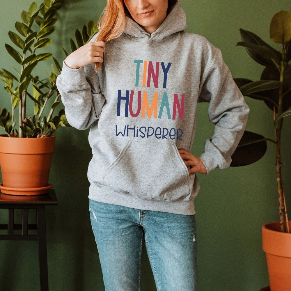 Tiny Humans Whisperer funny sweatshirt gift idea for teacher, trainer, instructor and homeschool mama. Show appreciation to your favorite grade teacher with this retro bold and colorful humorous shirt. Perfect for elementary, middle or high school, back to school, last day of school, summer or spiring break. Great for everyday use both in and out of the classroom.