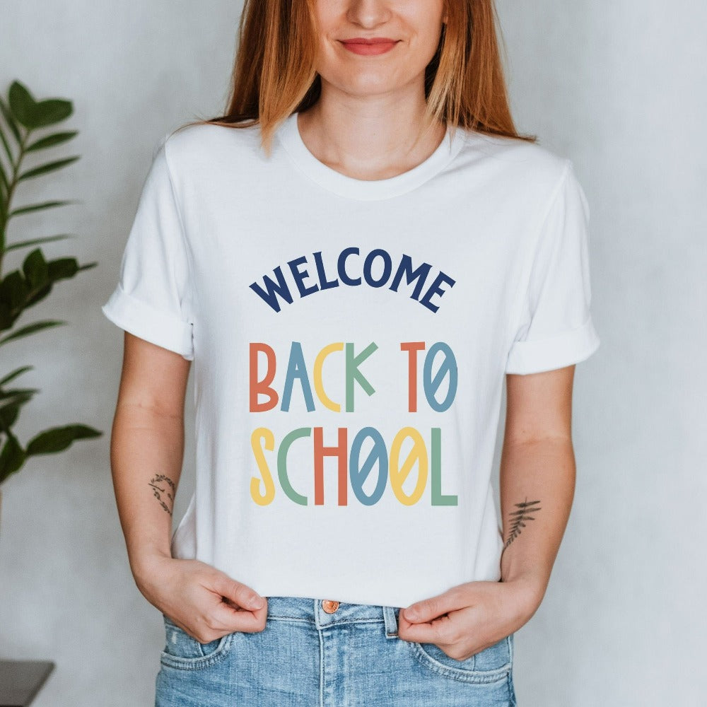 First day welcome back to school new grade teacher t-shirt. This cute and unique shirt is great for school start, and makes a great gift idea for your favorite elementary, middle or high school teacher. Grab this for your staff teacher school crew as a matching shirt.