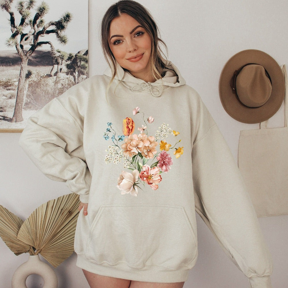 Bright, beautiful, simple and elegant. This adorable boho botanical floral sweatshirt is a favorite. With wild flowers and cottage core vibes, it is perfect for any nature lover, plant lover or really anyone that appreciates the outdoors. The watercolor flower arrangement in pastel colors makes this graphic hoodie unique and beautiful. Perfect gift idea for birthday, Christmas holiday, Mother's Day, Thanksgiving or anniversary.